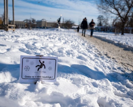 A slippery warning sign is pictured in Prague, the Czech Republic.