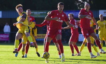 Worthing, in red shirts, in action against Plymouth Parkway in an FA Cup qualifier.