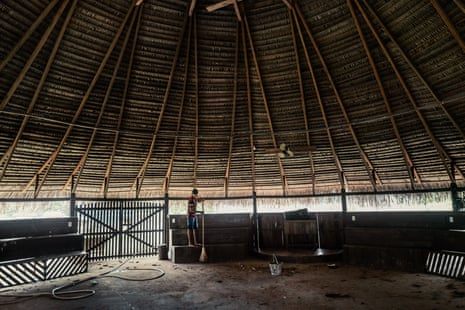 Circular structure has wide, overarching thatched roof