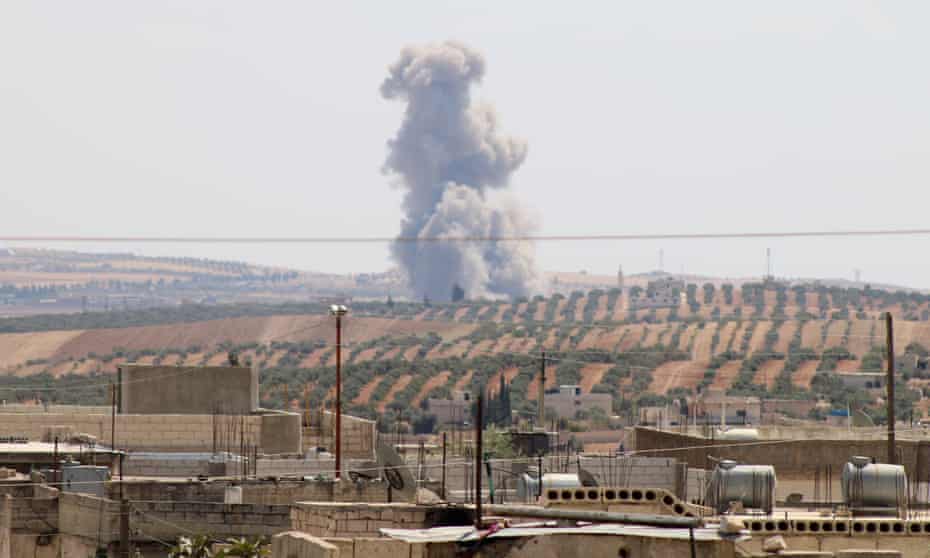 Smoke rises after warplanes belonging to the Assad regime and Russia carried out airstrikes on Idlib on Saturday.