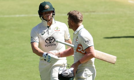 David Warner shakes hands with Steve Smith as Australia go to tea at 210-2.