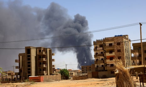 Smoke rising above buildings after an aerial bombardment in Khartoum North, Sudan.
