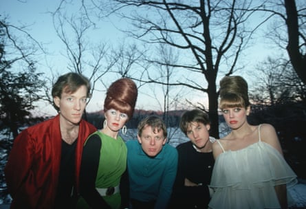 Outdoor shot with the band in their characteristic colourful clothes and beehive hairstyles