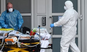 Staff transporting a patient at the Royal Liverpool hospital during the first wave of the coronavirus pandemic.