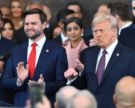 people in formal wear stand and clap