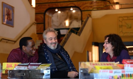 Micheal Ward, left, Sam Mendes and Olivia Colman on the set of Empire Of Light.