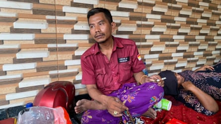 Muhammad Faisol anxiously awaiting news of his son in Sidoarjo, East Java.