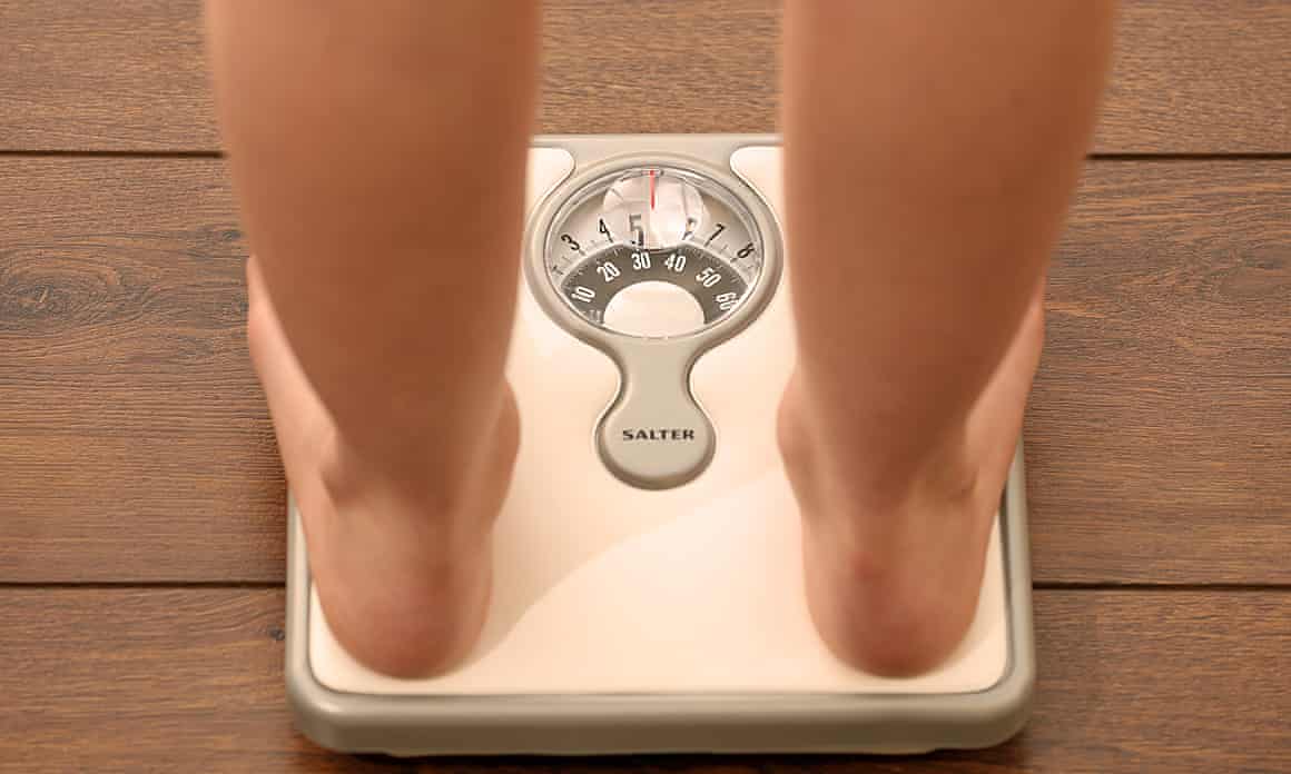A person standing on scales