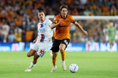 Fer Lopez runs with the ball under pressure from Todd Cantwell.