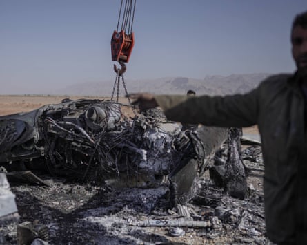 Closeup of crane hook lifting debris