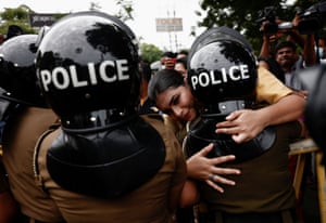 Colombo, Sri Lanka. Hirunika Premachandra, a politician and a leader of Samagi Vanitha Balawegaya, which is part of the main opposition party, hugs a female police office during a protest at near the home of the prime minister, Ranil Wickremasinghe
