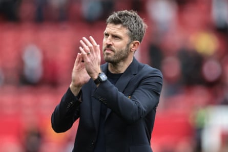 Michael Carrick applauds the fans