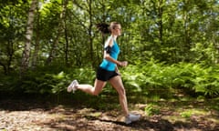 Woman running in a forest