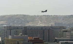A US military helicopter is pictured flying above the US embassy in Kabul.