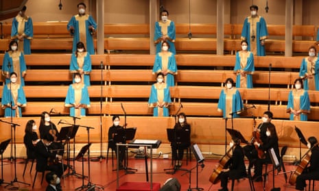 Choir members wear mask as they pray during a Easter worship as South Koreans take measures to protect themselves against the spread of coronavirus at the Yoido Full Gospel Church on 12 April 2020 in Seoul, South Korea.