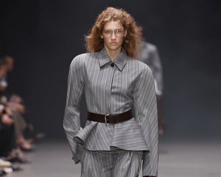 A model in a big grey suit.