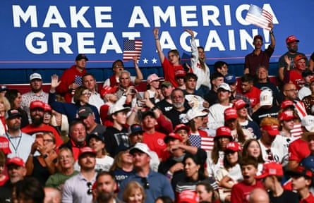 Attenders cheer as Donald Trump arrives to speak during the rally in Park City, Kansas