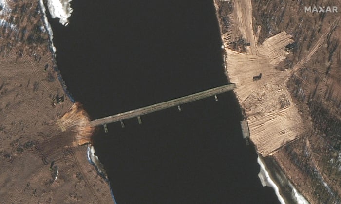A satellite image released by Maxar Technologies shows a close-up of recent road construction and a new Ponton bridge over the Pripyat river, Belarus, on 15 February.