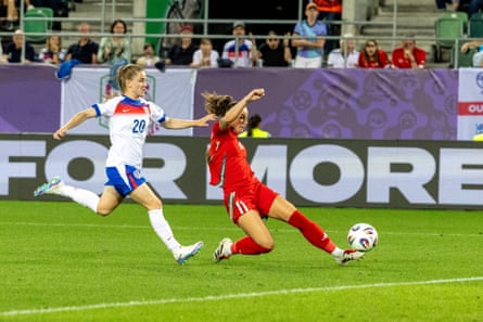 Hannah Cain successful action for Wales against England astatine Euro 2025 successful Switzerland.