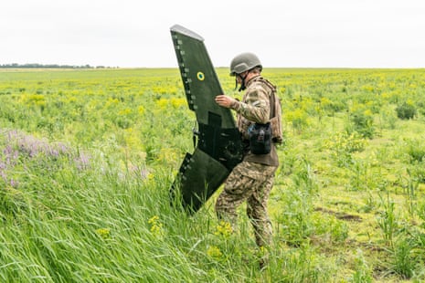 A member of the Ukrainian armed forces handles a drone designed and produced in Ukraine and used for reconnaissance of Russian positions at an undisclosed location in Donetsk.