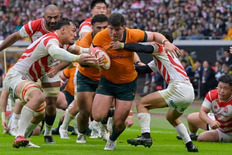 Australia’s Josh Nasser takes on the tacklers