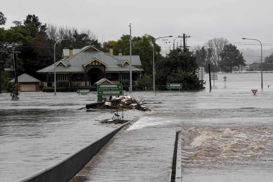 Debris is seen as the Windsor Bridge is submerged under floodwater from the swollen Hawkesbury River.