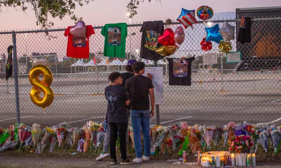 High schoolers at a makeshift memorial at the NRG Park grounds, where Astroworld was held.