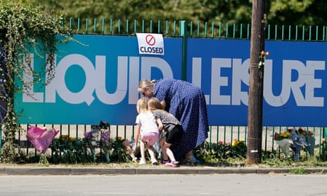 People leave flowers outside Liquid Leisure in Windsor, following the death of an 11-year-old girl on Sunday 7 August.