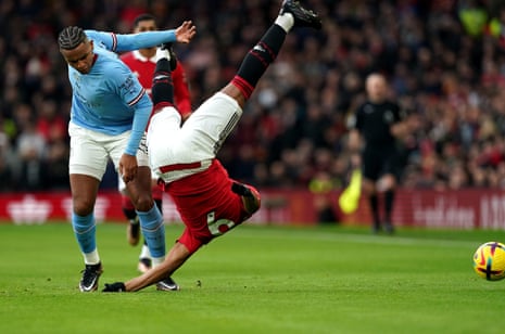 Manuel Akanji stands his ground as the martial jump goes in.