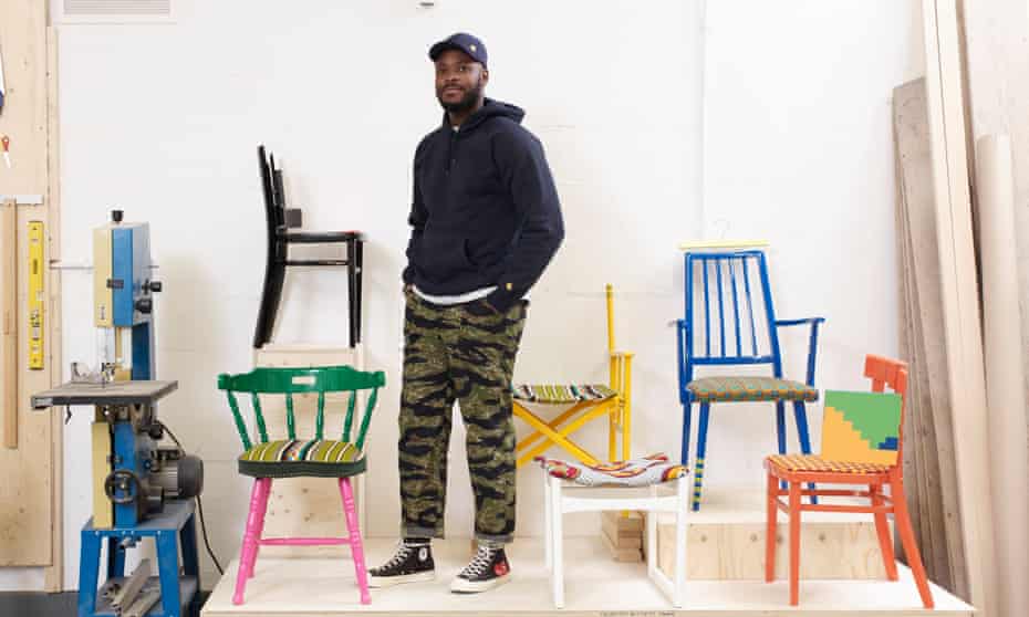 Yinka Ilori photographed last month with his chairs.