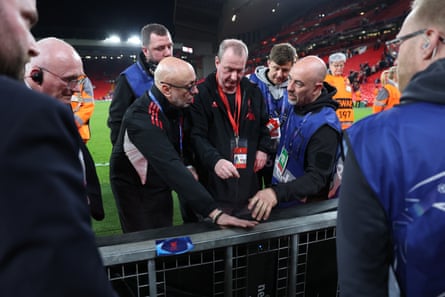 Ground staff and members of Liverpool investigate the area where Noa Lang sustained a thumb injury that required surgery.