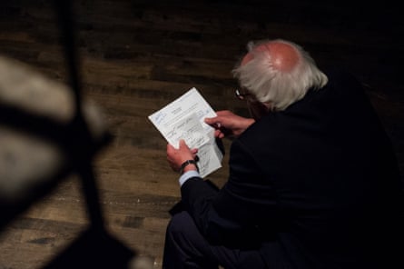 Senator Bernie Sanders reviews his notes backstage before speaking at the event.