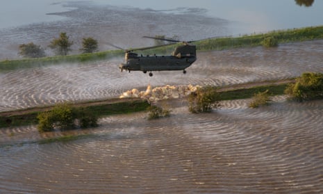 RAF Chinook helicopter over flood waters