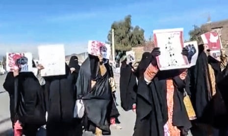 Women marching with anti-regime placards in the city of Zahedan, in Sistan-Baluchistan province
