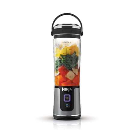 A Ninja Blast Cordless Portable Blender full of fruit.