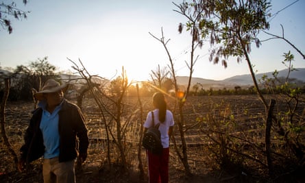 Francisco Sical and Melissa Sical get ready to walk her to school as the sun rises over their village in Baja Verapaz, Guatemala, in early March 2020.