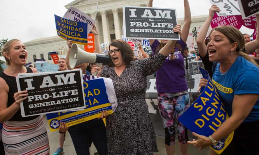 Protesters on each side of the abortion debate clash in front of the US supreme court in June 2016.