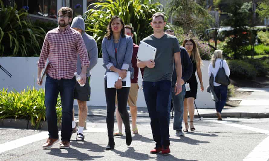 YouTube employees are seen walking away from company’s headquarters after the shooting.