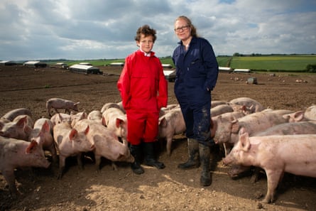 Pig farmer Anna Longthorp with her son Richard, 10, and her pigs