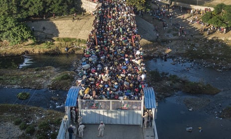 Haitians wait to cross the border in to Dominican Republic in Dajabon, Dominican Republic.