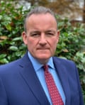 Head and shoulders shot of David Neal in a suit