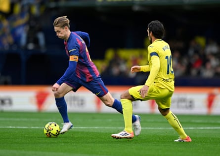 Barcelona’s Frenkie de Jong on the ball, watched by Villarreal’s Dani Parejo