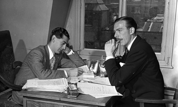 Denis Norden, left, and Frank Muir in their office in the 1950s writing scripts for the radio show Take It from Here.