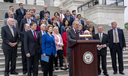 Chuck Schumer, center, and other Democrats speak on the supreme court’s leaked draft opinion on abortion in Washington.