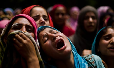 A relative of Auqib Ahmad Bhat mourns on seeing his dead body