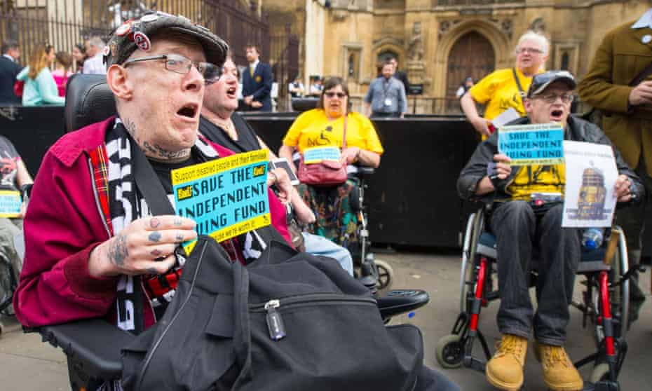 Disabled people protest at parliament about the loss of the independent living fund