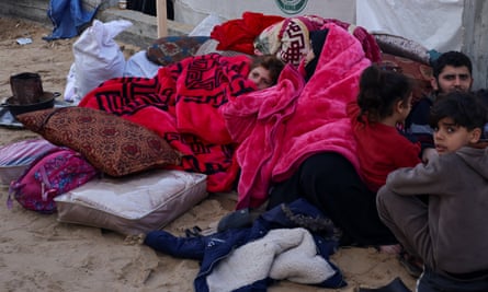 Displaced Palestinians shelter in a tent camp in Rafah in Rafah, southern Gaza Strip, on 3 January.
