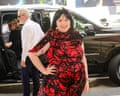 Lena Dunham poses beside a vehicle in New York City