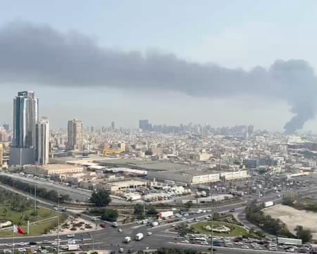 Smoke rises after a missile attack on the service center of the US Fifth Fleet in Manama, Bahrain