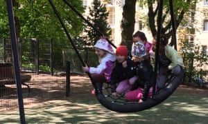 Children on large swing
